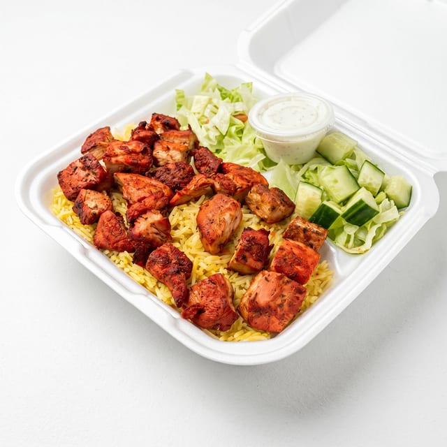 Chicken Shish Kebab Over Rice & Salad.