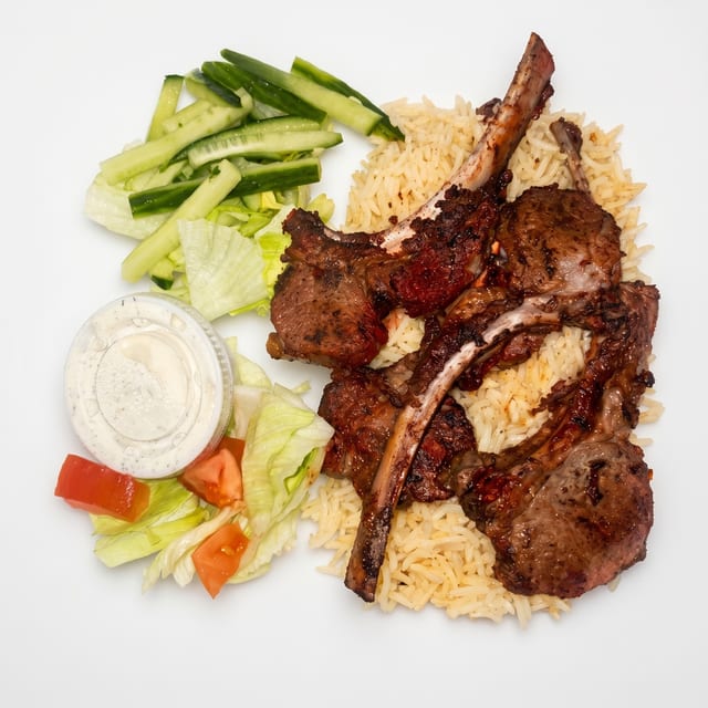 Lamb Chops Over Rice & Salad Plate.